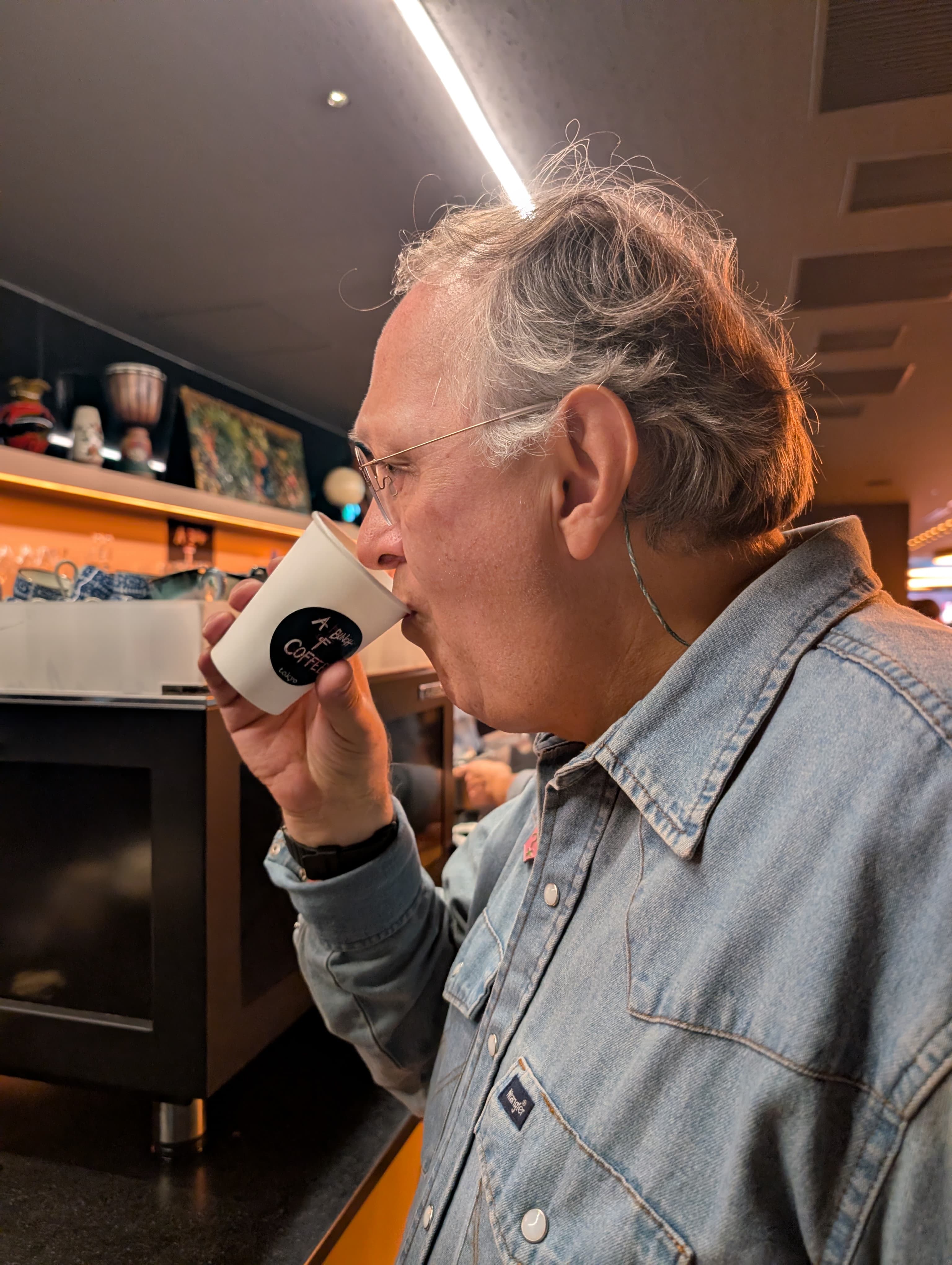 A guest enjoying coffee at the exhibition café